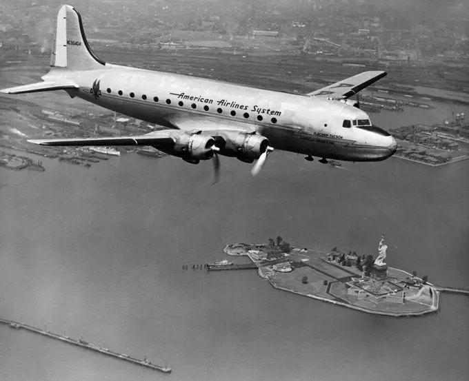 USA, New York State, New York City, New York Harbor, American Airlines plane over Statue of Liberty