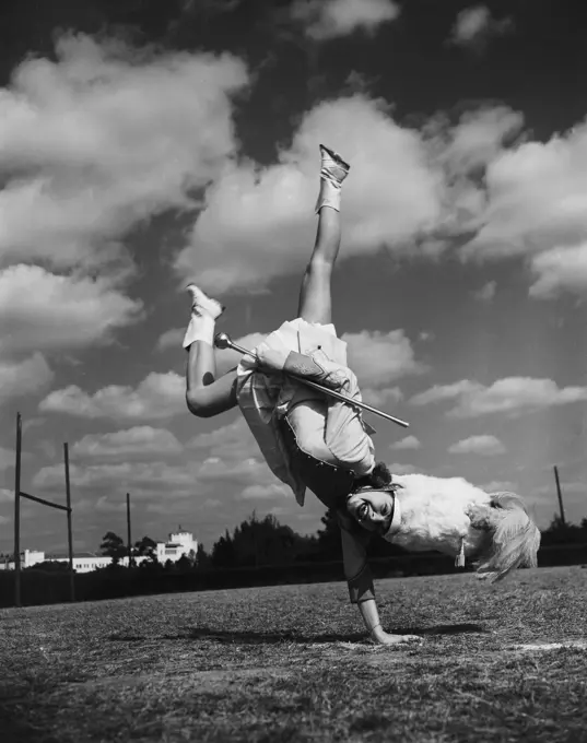 Majorette performing and doing handstand