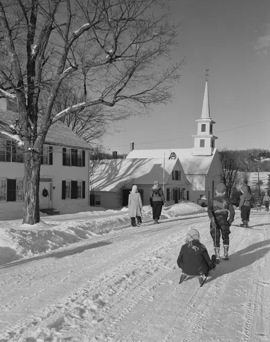 USA, Vermont, Waterford, Main Street with children going home from school