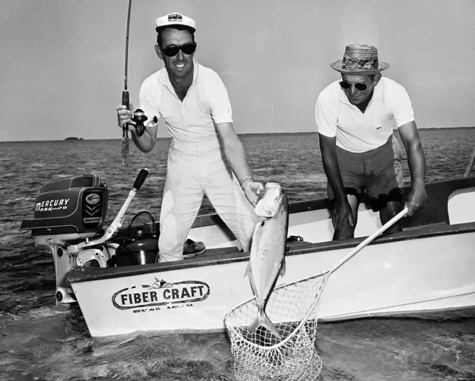 USA, Florida, Marquesas Key, Fishermen landing Bar Jack fish