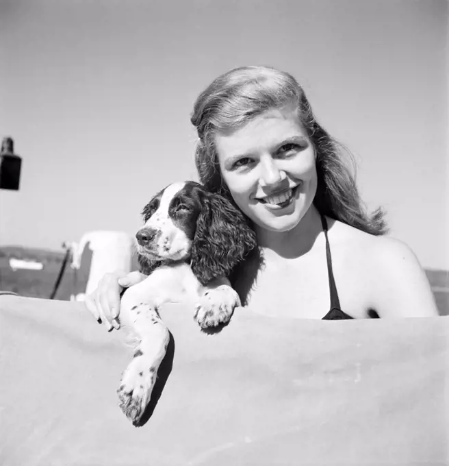Portrait of young woman with dog
