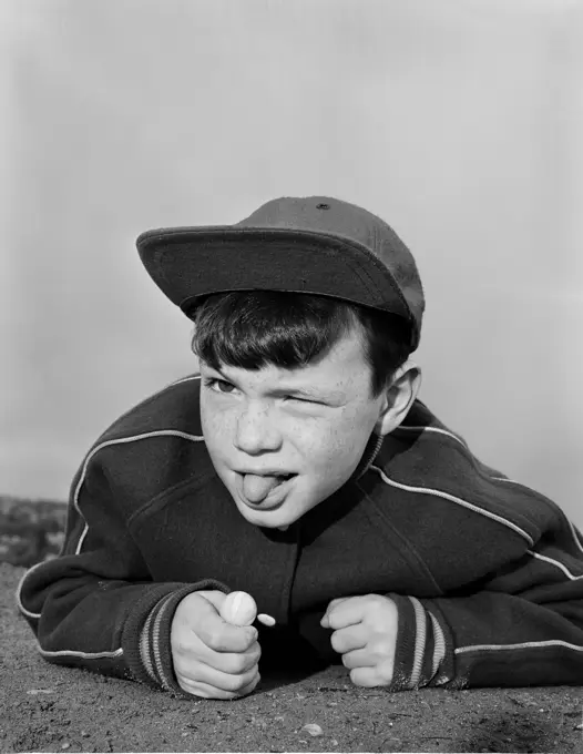 Boy sticking out tongue