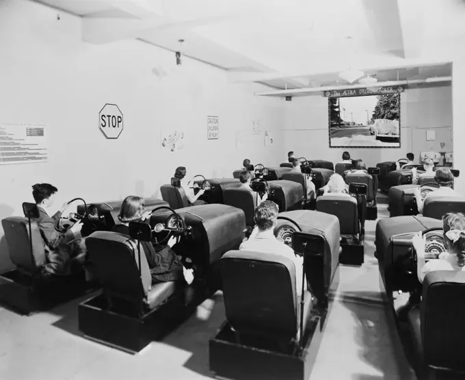 USA, Illinois, Oak Park, Forest High School, Group of teenagers learning to drive in driver training class