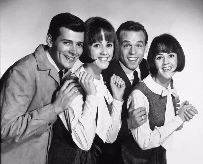 Portrait of two teenage couples smiling