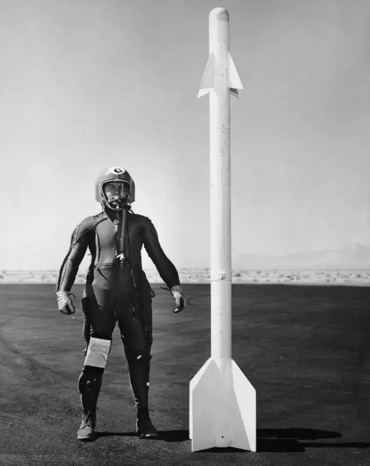 Army soldier standing near a missile