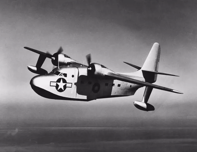 Side profile of a military airplane in flight, JR2F Albatross, US Navy