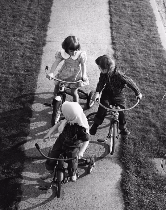 Children on tricycles