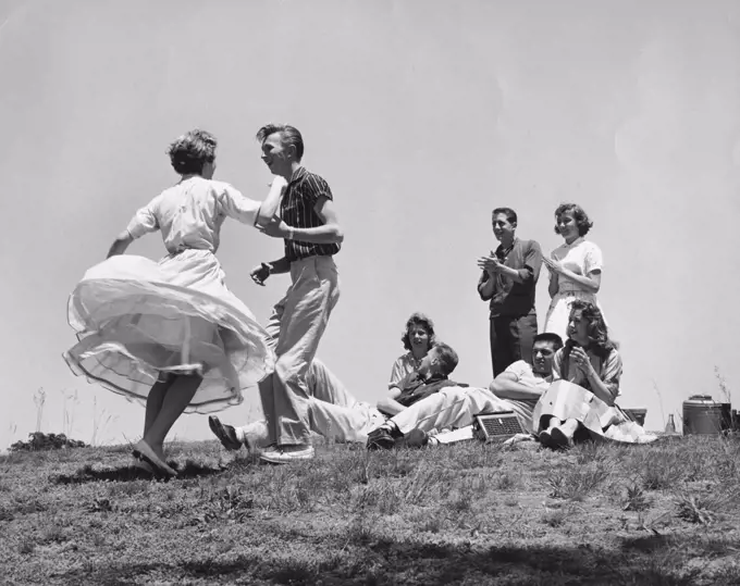 Low angle view of a teenage couple dancing