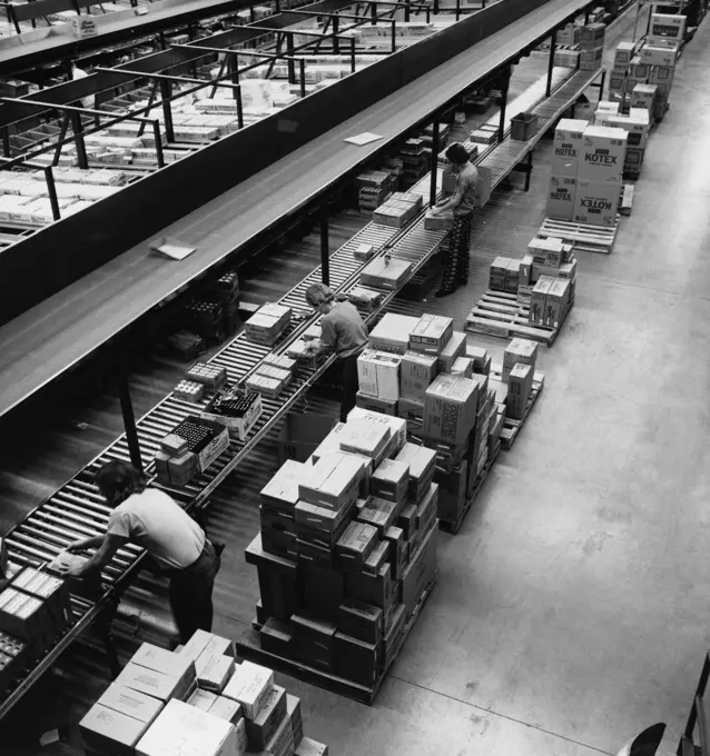 High angle view of manual workers working in a factory