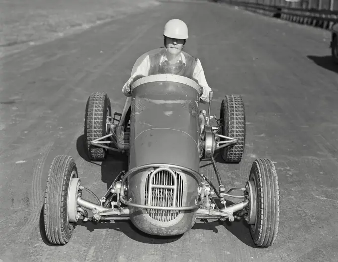 Vintage photograph. Man driving Allen Offy - Special midget auto racer