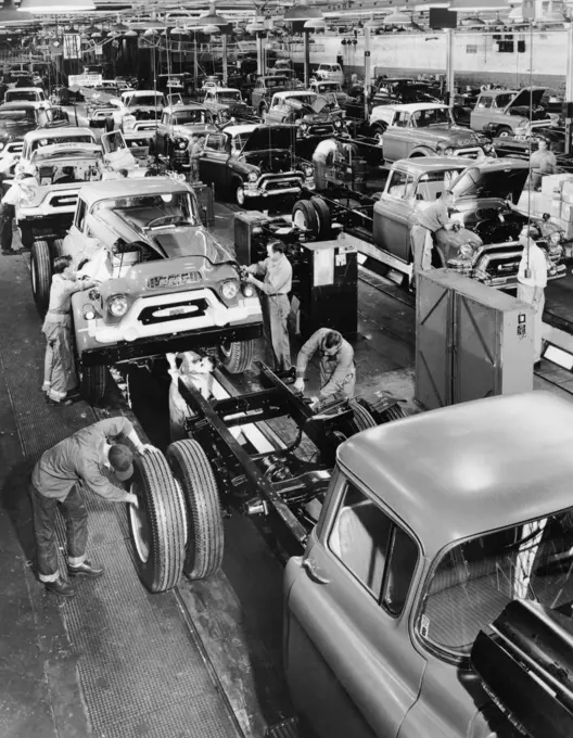 Trucks being assembled in an automobile manufacturing plant