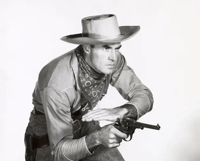 Close-up of a cowboy cocking his pistol