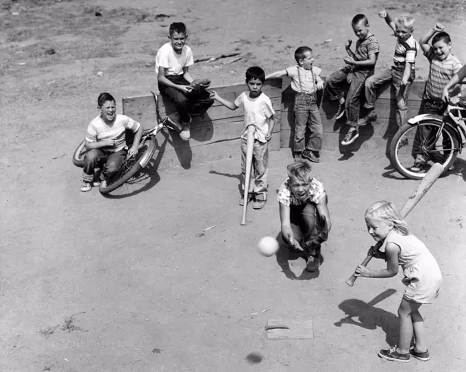 Group of children playing baseball