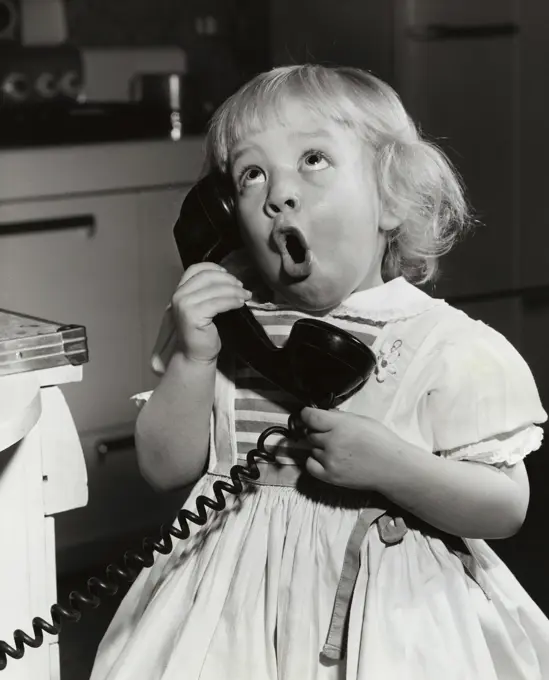 Close-up of a girl talking on the telephone