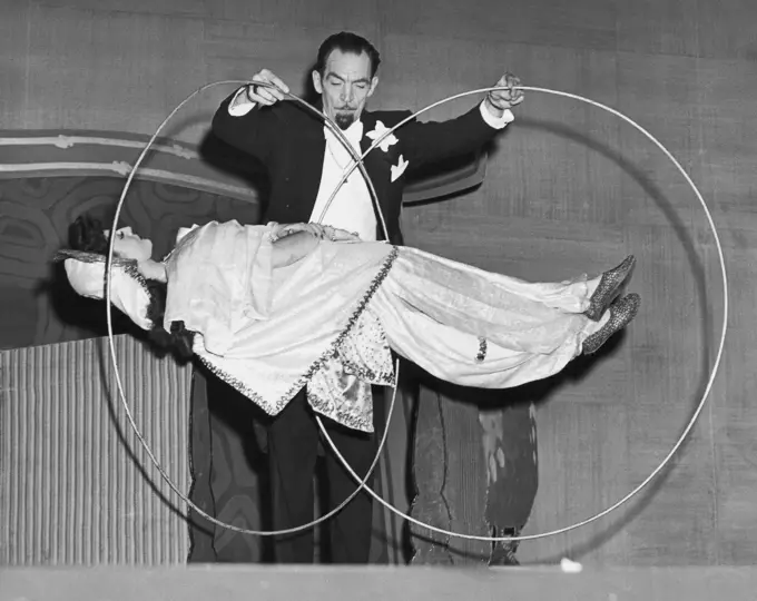 Magician levitating a woman