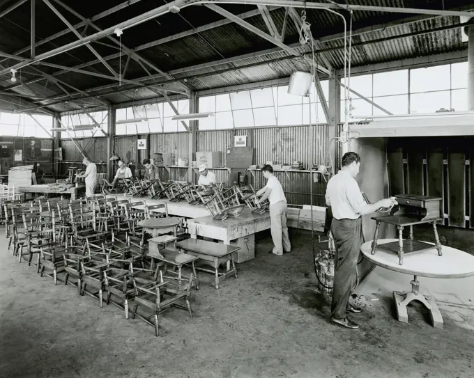 Group of workers in a woodshop