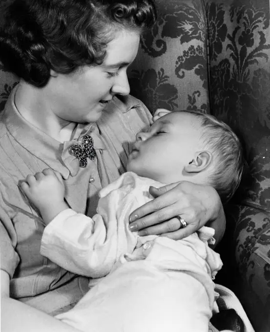 Mother holding sleeping child