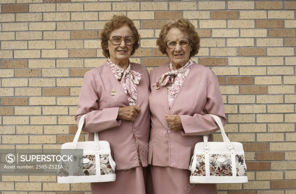 Twin adult woman dressed alike