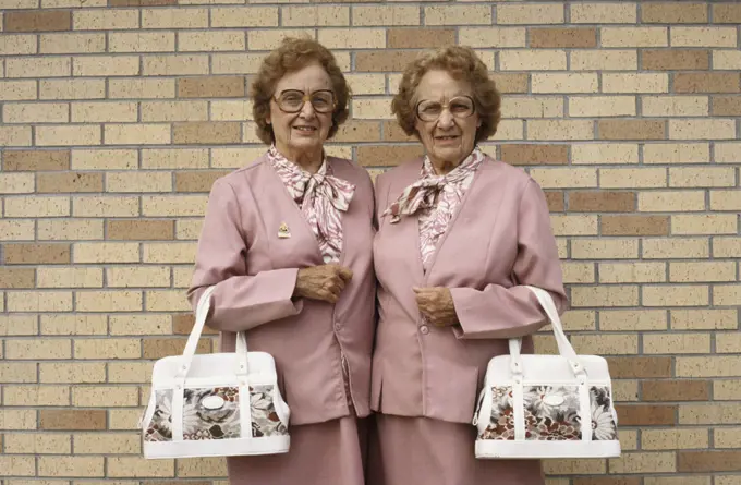 Twin adult woman dressed alike