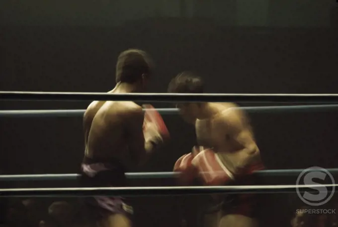 Two young men boxing in a boxing ring