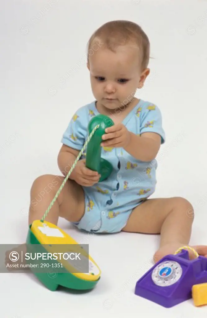 Baby boy playing with toys