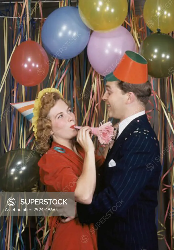 Mid adult couple dancing at New Year's party