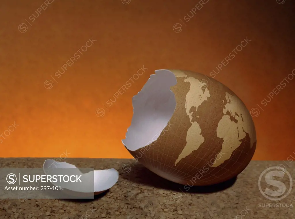 Close-up of a broken egg depicting a globe