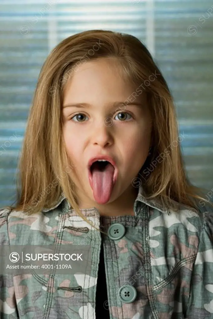 Close-up of a girl sticking her tongue out