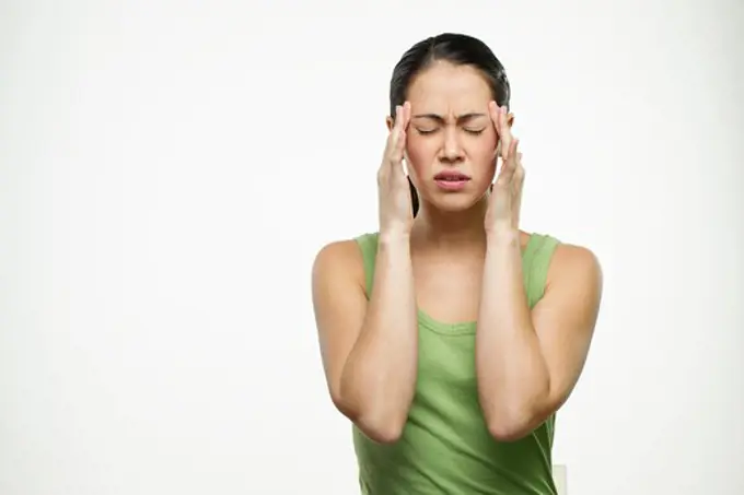 Young woman suffering from a headache