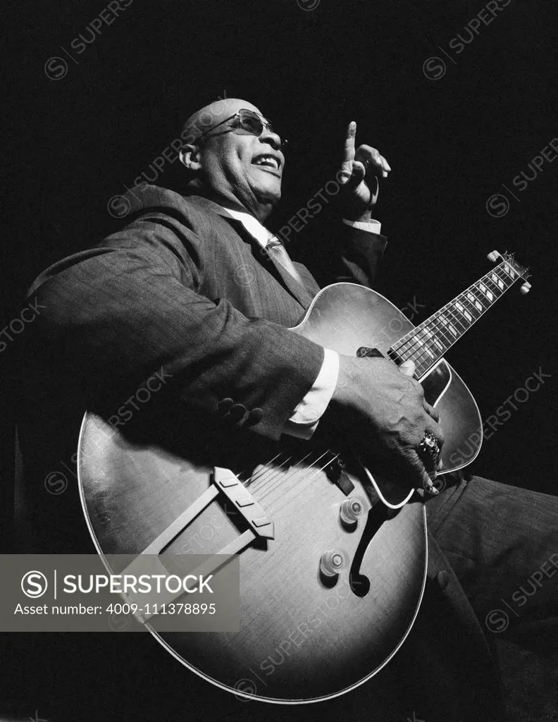 African American man playing guitar