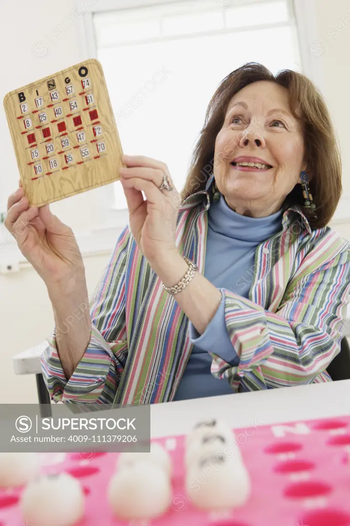 Elderly woman winning at bingo