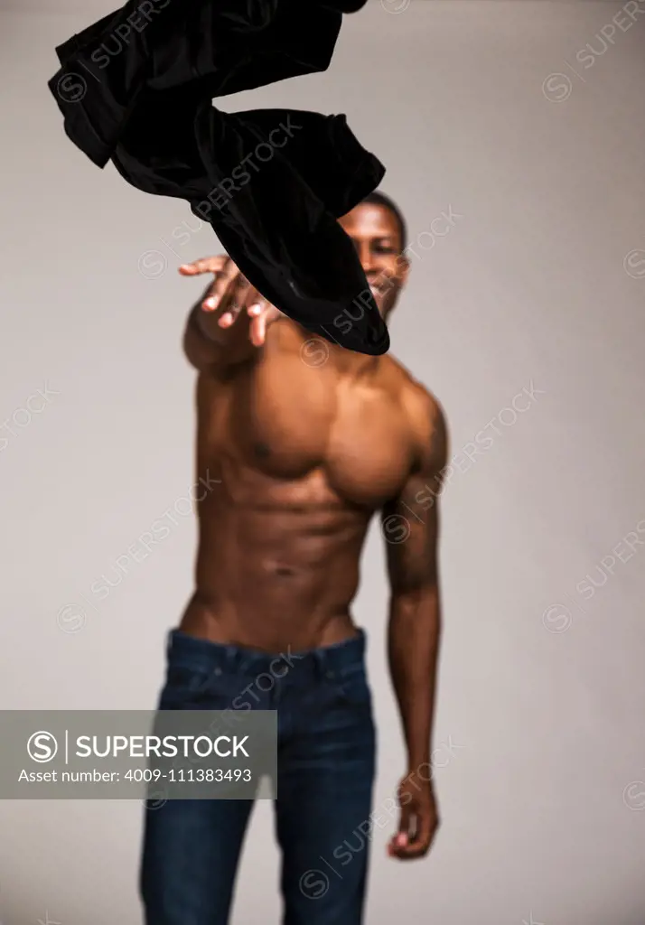 Man tossing shirt