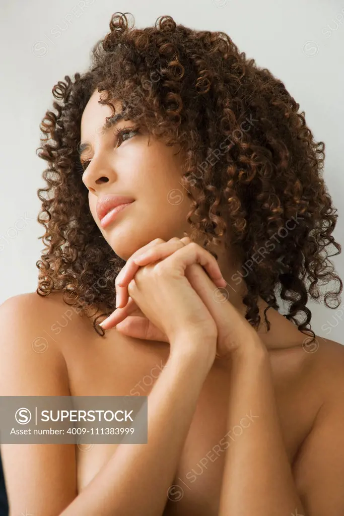 Naked muscular Mixed Race woman covering breasts in box, Stock Photo,  Picture And Royalty Free Image. Pic. BIM-BLD239315
