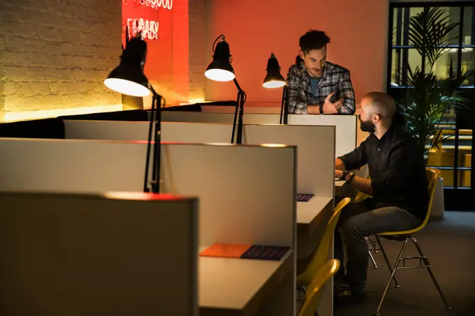 man working late in co-working space