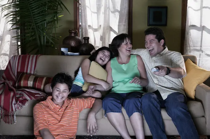 Hispanic family watching television