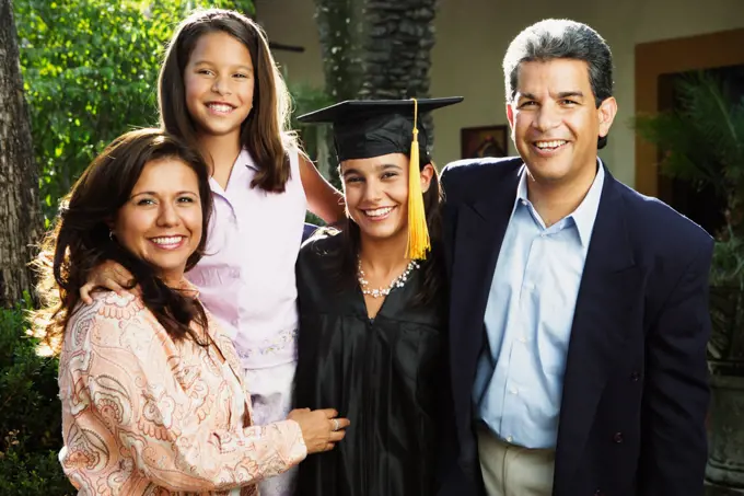 Graduate and family smiling for the camera