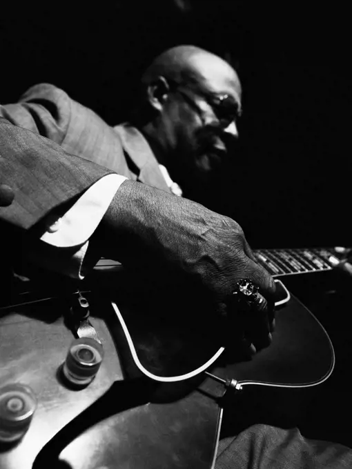 African American man playing guitar