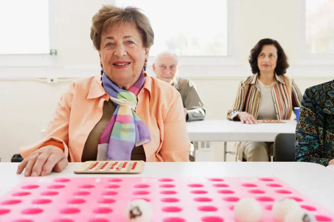 Elderly woman playing bingo