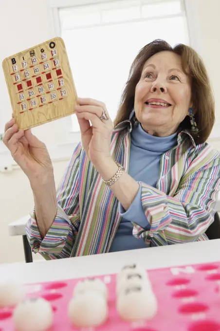 Elderly woman winning at bingo