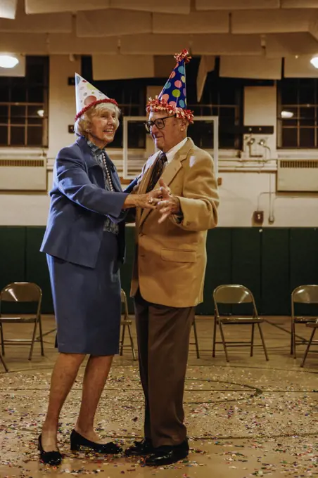 Elderly couple dancing in a gym