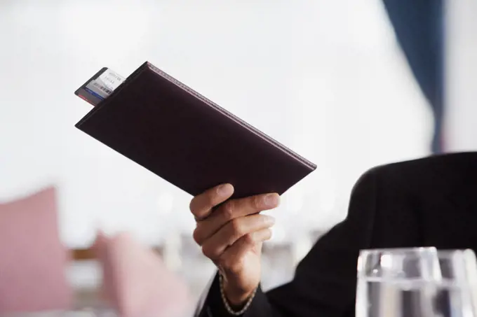 Businessman paying the check at restaurant