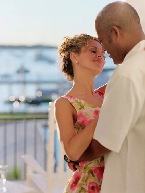 Middle-aged couple dancing outdoors