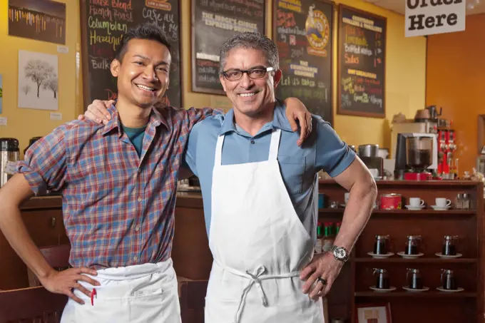 Partners of cafe standing together