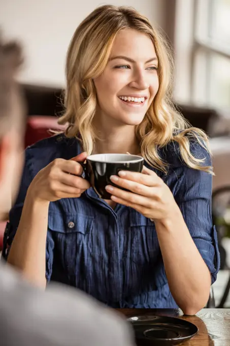 Caucasian couple drinking coffee together