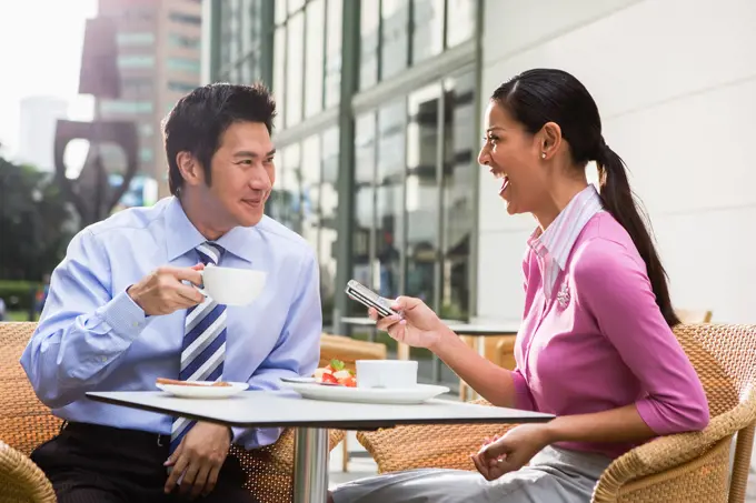 Couple having breakfast together in cafe