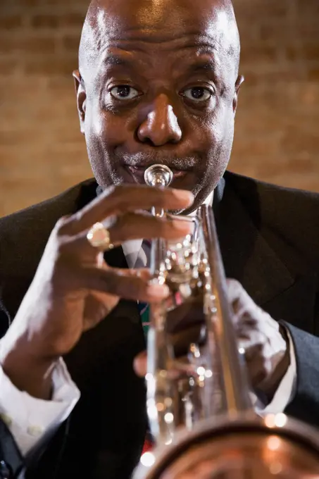 African man performing on trumpet