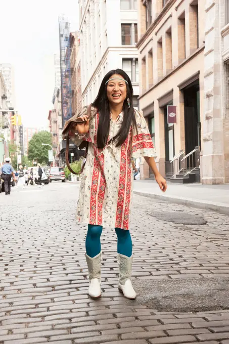 Japanese woman smiling on city street