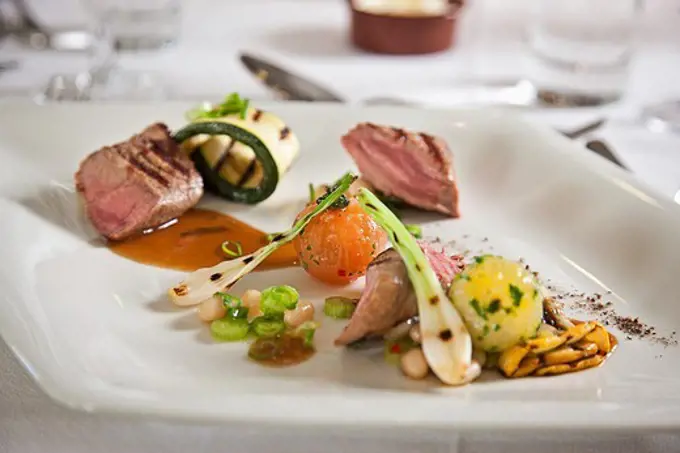 Gourmet grilled steak and vegetables served in a plate