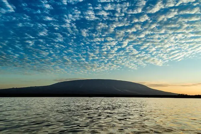 Ecuador, Galapagos Islands, Mountain and sea at sunset