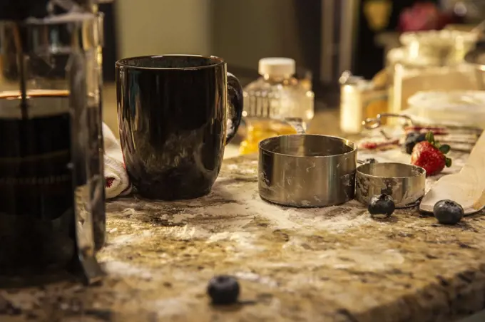 Messy kitchen counter after making blueberry pancakes 